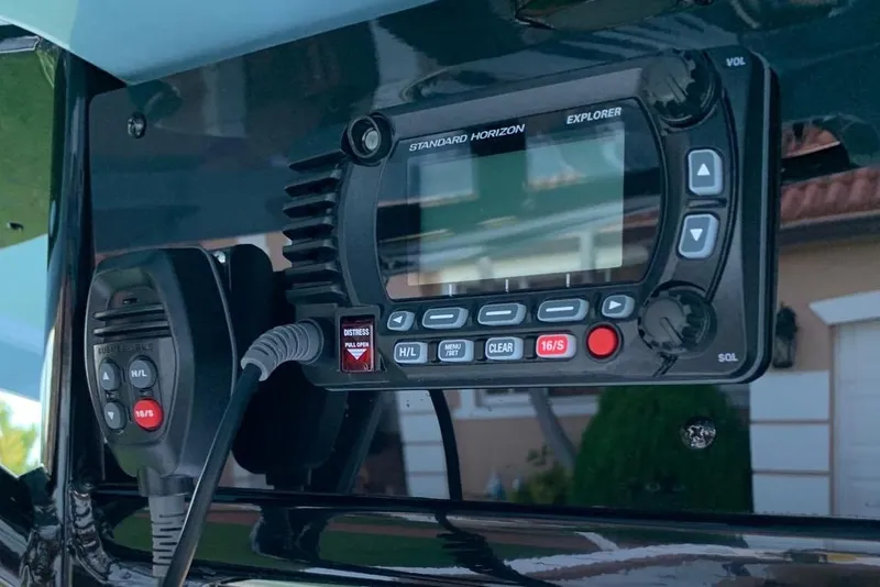 Slide: The Image of VHF radio system on 2022 Sea Hunt Gamefish 25 boat dashboard. - 13