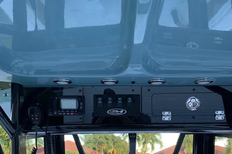 Slide: The Image of 2022 Sea Hunt Gamefish 25 console with radio and control panel. - 19