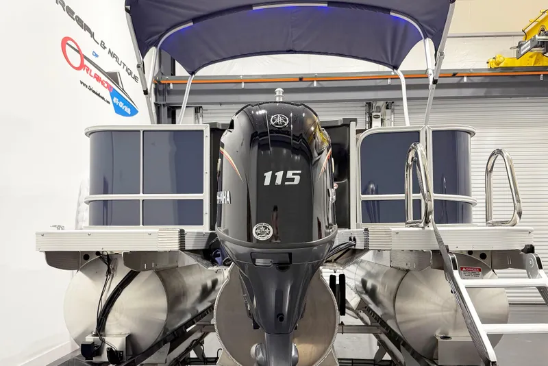 Slide: The Image of 2025 Bennington 20S pontoon boat with Yamaha 115 engine in showroom. - 4