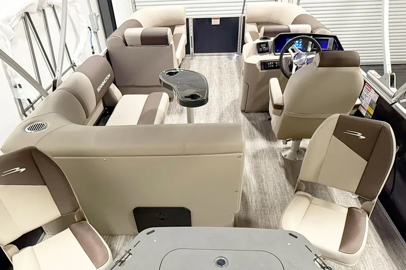 Slide: The Image of Interior of 2025 Bennington 20S pontoon boat with beige seating and modern helm. - 6