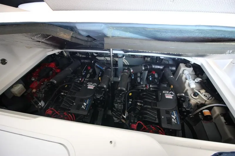 Slide: The Image of Engine compartment of a 2000 Sea Ray 340 Sundancer boat, showcasing dual engines. - 21