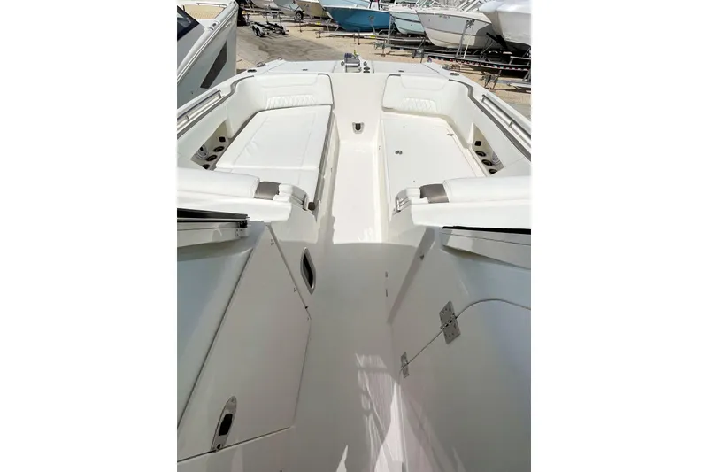 Slide: The Image of 2021 World Cat 325 DC boat interior with spacious seating and sleek design. - 2
