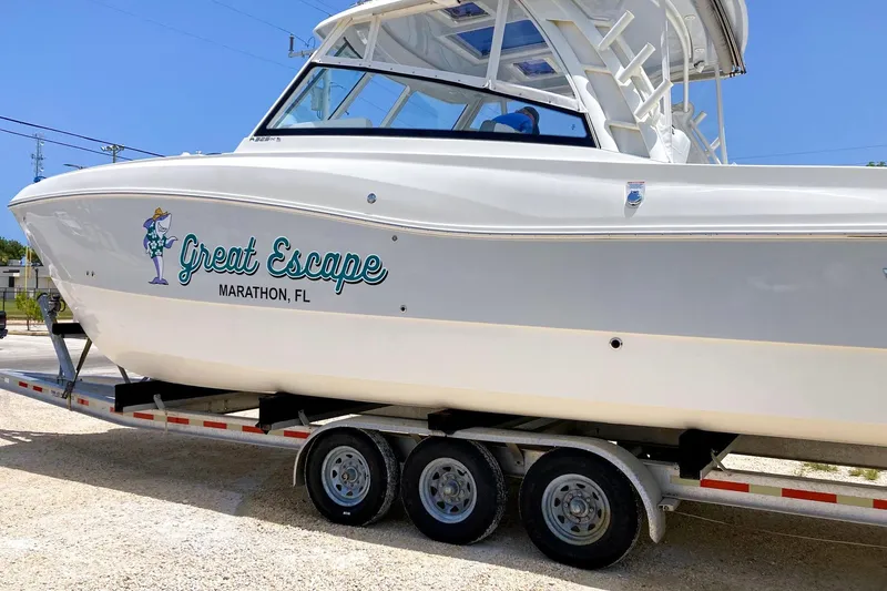 Slide: The Image of 2021 World Cat 325 DC boat named "Great Escape" on a trailer in Marathon, FL. - 8
