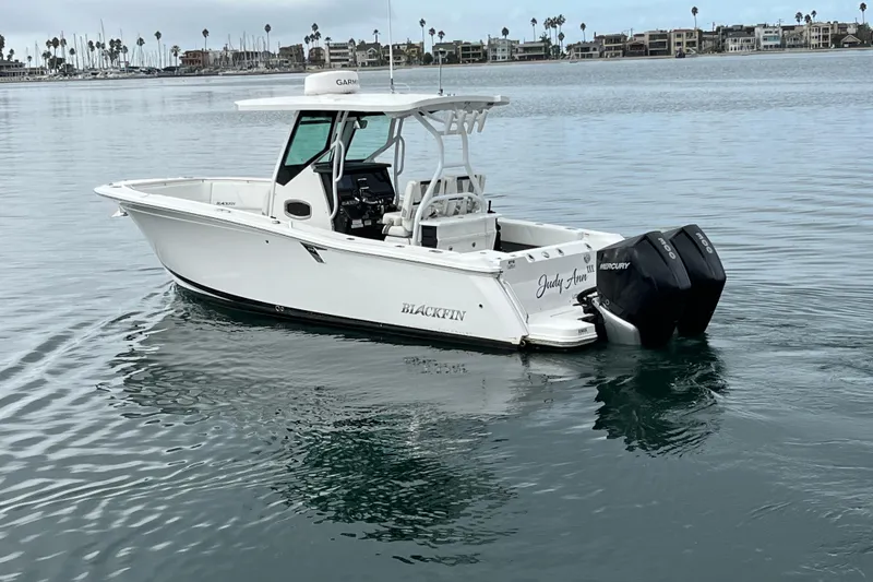 The Image of 2019 Blackfin 272 CC boat on calm water with twin Mercury engines. - 0