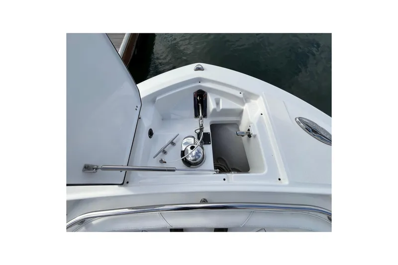 Slide: The Image of 2019 Blackfin 272 CC boat anchor compartment with stainless steel hardware and open hatch. - 11