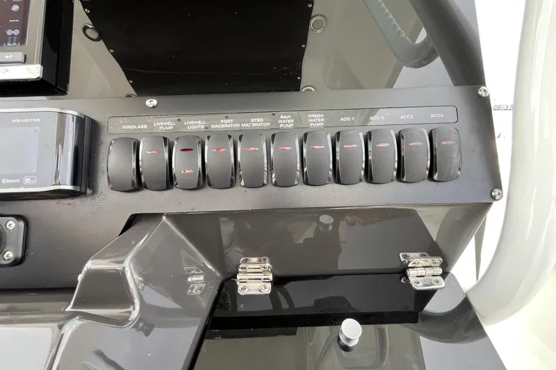 Slide: The Image of Control panel of a 2019 Blackfin 272 CC boat with labeled switches. - 21