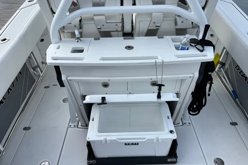 Slide: The Image of 2019 Blackfin 272 CC boat interior with fishing station and Yeti cooler. - 28