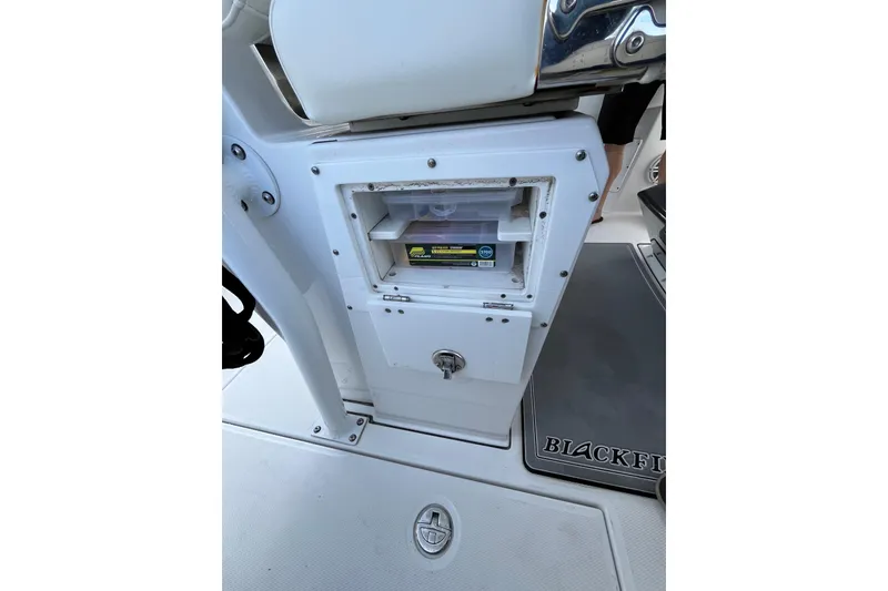 Slide: The Image of 2019 Blackfin 272 CC boat storage compartment with tackle box. - 33