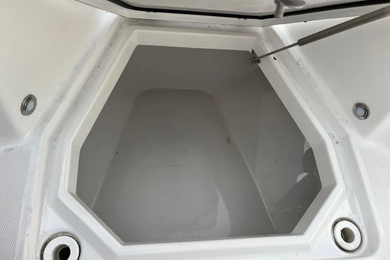 Slide: The Image of Storage compartment of a 2019 Blackfin 272 CC boat, open and empty. - 9