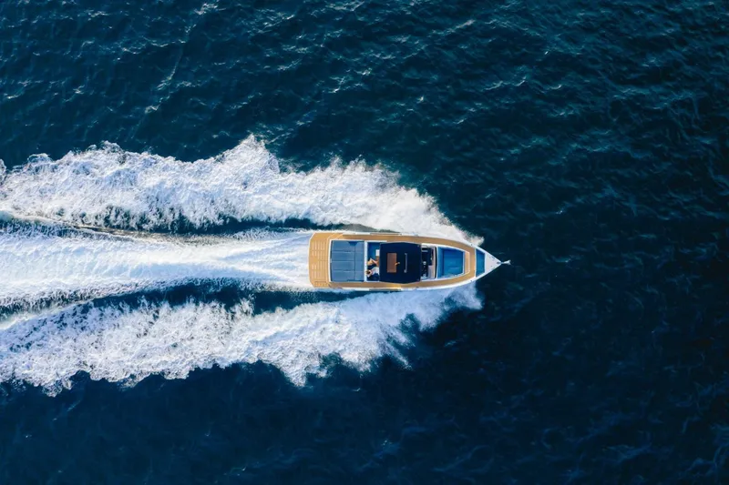 Slide: The Image of Aerial view of 2026 De Antonio Yachts 50 Open cruising on open water. - 4