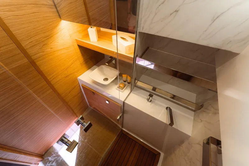 Slide: The Image of Luxurious bathroom interior of 2026 De Antonio Yachts 50 Open, featuring modern sink and wood accents. - 22