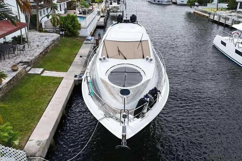 Slide: The Image of 2009 Lazzara LSX 75 yacht docked in a canal, aerial view. - 10