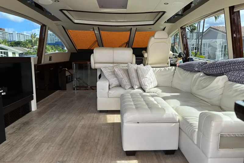 Slide: The Image of Luxurious interior of 2009 Lazzara LSX 75 yacht with white leather seating and panoramic windows. - 17