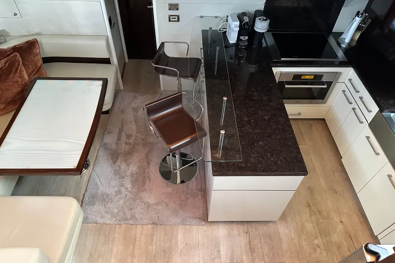 Slide: The Image of Luxurious kitchen interior of 2009 Lazzara LSX 75 yacht with modern appliances and seating. - 27