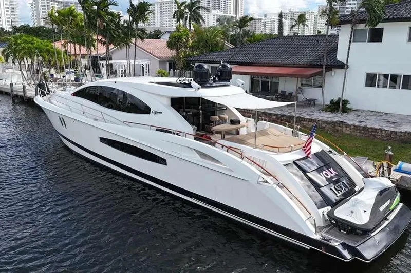 Slide: The Image of Luxury 2009 Lazzara LSX 75 yacht docked by waterfront homes. - 5