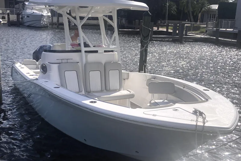 The Image of 2021 Sea Fox 249 Avenger boat docked on a sunny waterfront. - 0