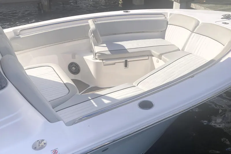 Slide: The Image of 2021 Sea Fox 249 Avenger boat interior with white cushioned seating. - 10