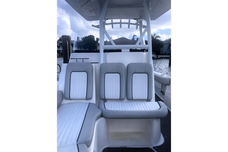 Slide: The Image of 2021 Sea Fox 249 Avenger boat interior with cushioned seating and water view. - 12