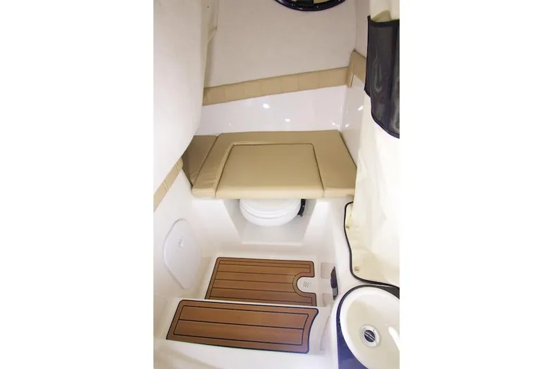 Slide: The Image of Manufacturer Provided Image: 2021 Sea Fox 249 Avenger cabin interior with cushioned seating and wooden flooring. - 14