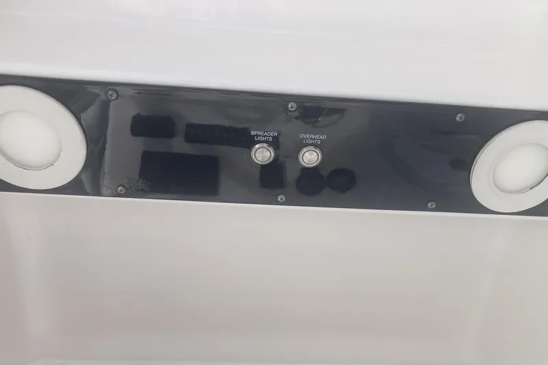Slide: The Image of Control panel of 2021 Sea Fox 249 Avenger boat with light switches. - 17