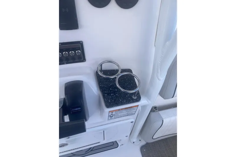 Slide: The Image of 2021 Sea Fox 249 Avenger boat console with cup holders and Yamaha controls. - 22