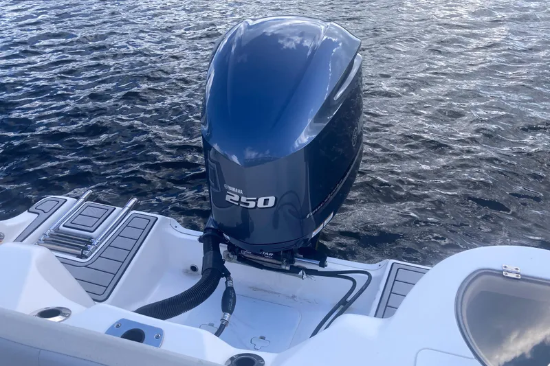 Slide: The Image of 2021 Sea Fox 249 Avenger boat with Yamaha 250 outboard motor on water. - 25