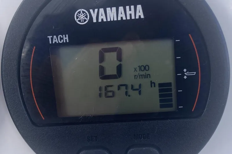 Slide: The Image of Yamaha tachometer displaying 167.4 hours on a 2021 Sea Fox 249 Avenger boat. - 26