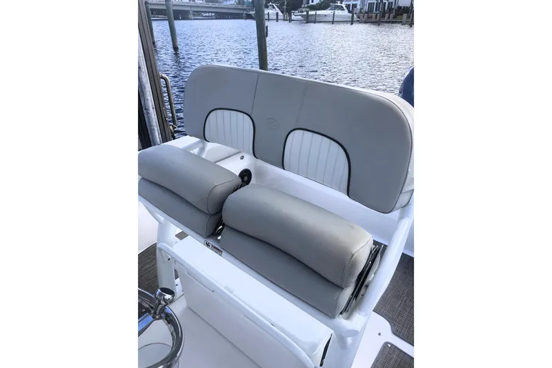 Slide: The Image of 2021 Sea Fox 249 Avenger boat seat with gray upholstery by the water. - 30
