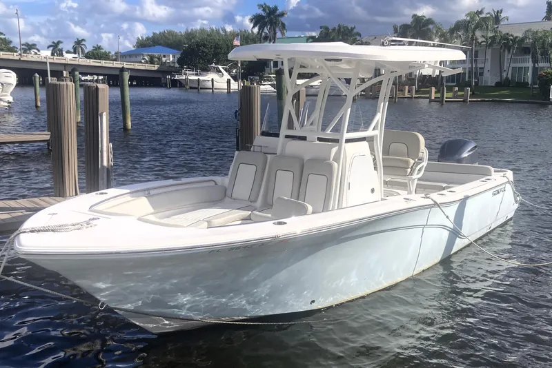 Slide: The Image of 2021 Sea Fox 249 Avenger boat docked on a sunny day by the water. - 5