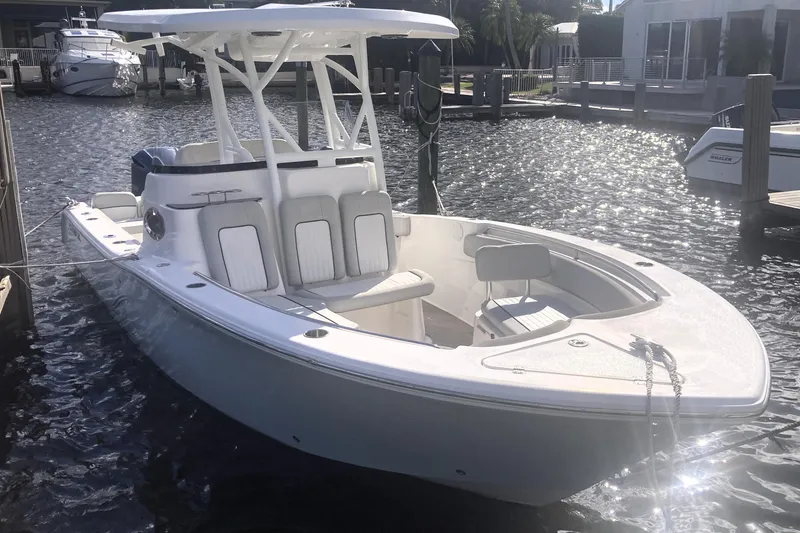 Slide: The Image of 2021 Sea Fox 249 Avenger boat docked in sunny marina setting. - 8