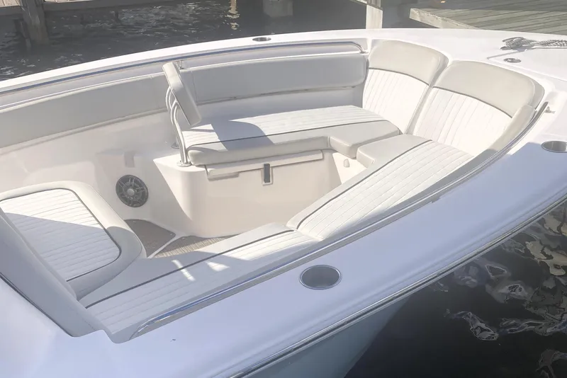 Slide: The Image of 2021 Sea Fox 249 Avenger boat interior with cushioned seating and speaker. - 9