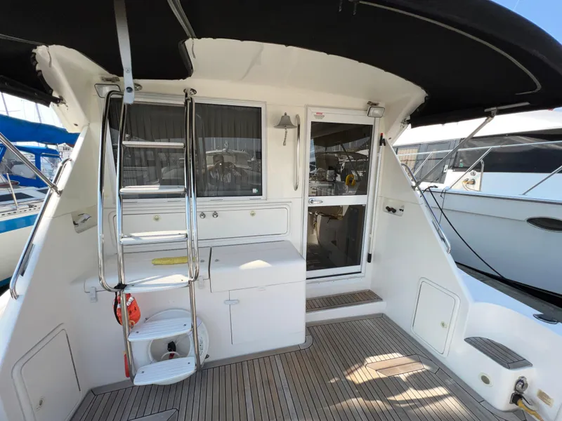 Slide: The Image of 2001 Riviera Twin Cabin Convertible with open cabin and ladder. - 13