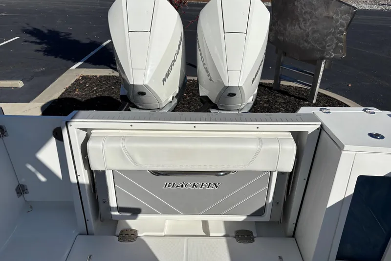 Slide: The Image of 2023 Blackfin 272CC boat with dual Mercury outboard engines, rear seating view. - 10