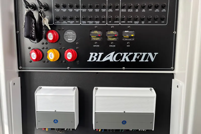Slide: The Image of Control panel of 2023 Blackfin 272CC boat with switches and indicators. - 12