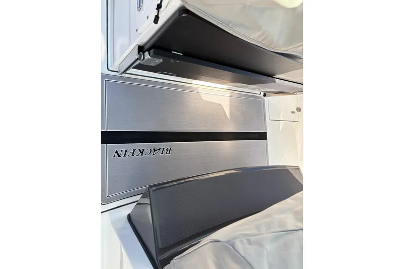 Slide: The Image of 2023 Blackfin 272CC boat interior with sleek design and modern features. - 14