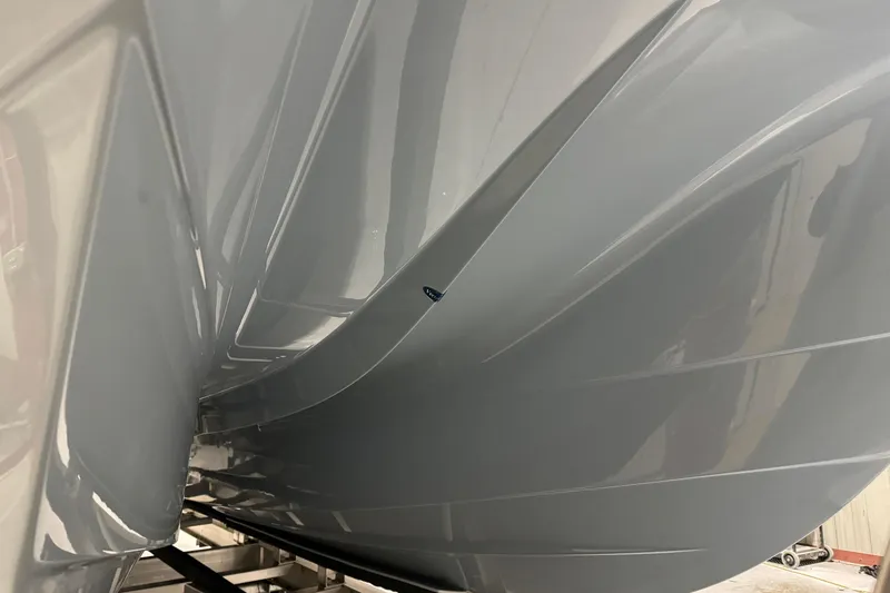Slide: The Image of 2026 World Cat 265 DC-X boat hull, sleek design, close-up view. - 39