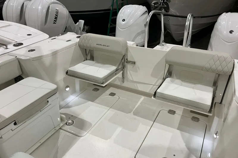 Slide: The Image of 2026 World Cat 265 DC-X boat interior with white seating and Yamaha engines. - 19