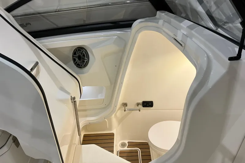 Slide: The Image of Interior of 2026 World Cat 265 DC-X boat, featuring a compact, modern marine bathroom. - 30