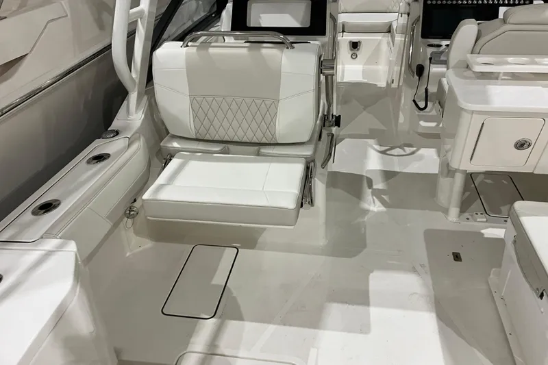 Slide: The Image of 2026 World Cat 265 DC-X boat interior with white seating and modern design. - 20
