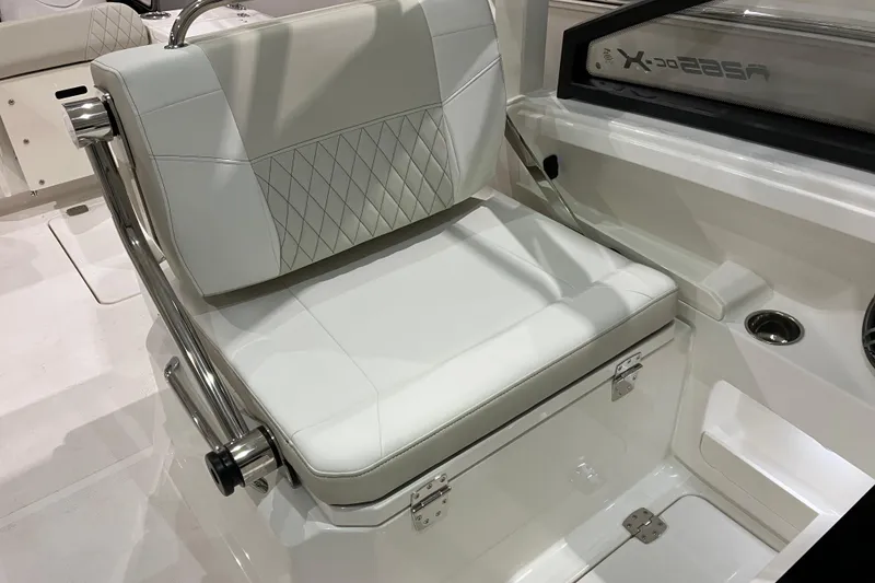 Slide: The Image of 2026 World Cat 265 DC-X boat interior with white cushioned seating and stainless steel accents. - 23