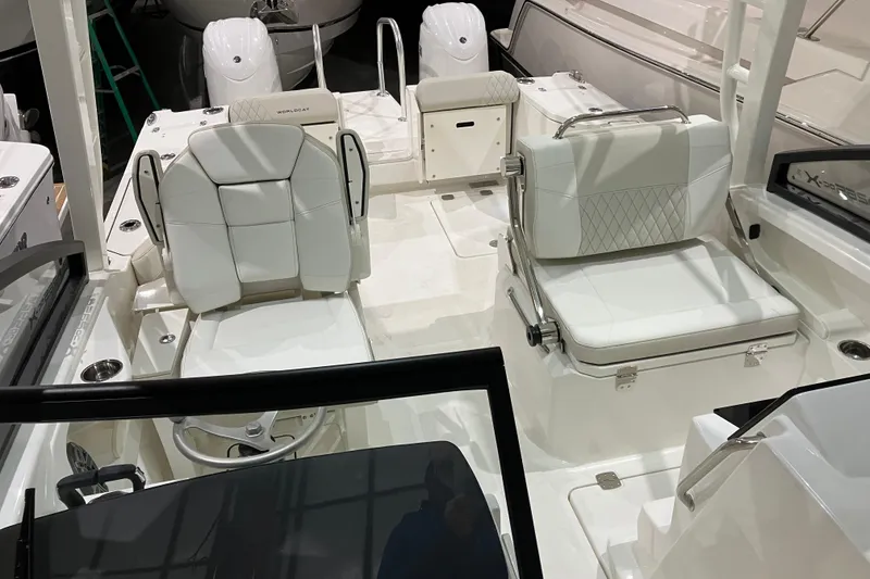 Slide: The Image of 2026 World Cat 265 DC-X boat interior with white seating and modern design. - 36
