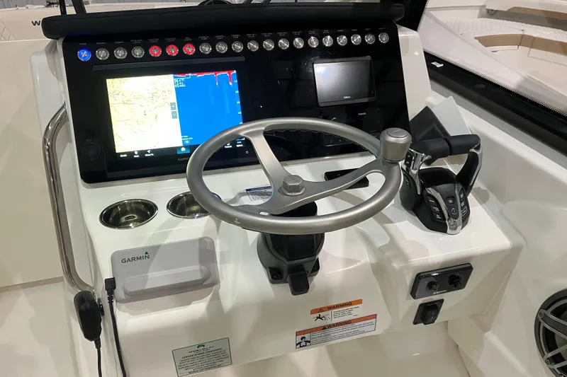 Slide: The Image of Steering console of 2026 World Cat 265 DC-X with Garmin navigation system. - 25