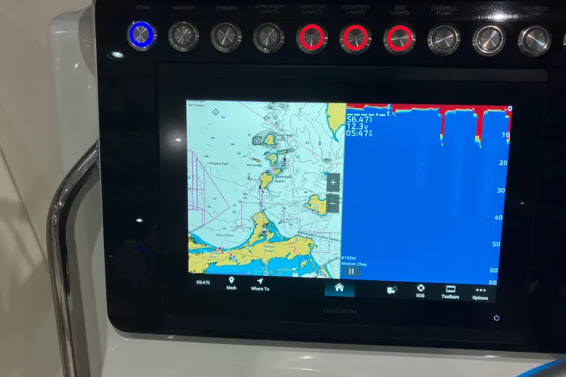 Slide: The Image of Garmin marine navigation display on 2026 World Cat 265 DC-X boat dashboard. - 26