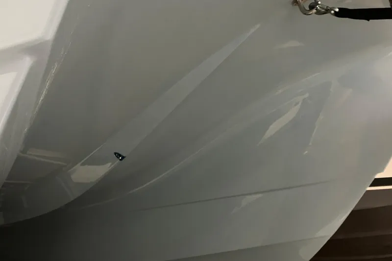 Slide: The Image of Close-up of 2026 World Cat 265 DC-X boat hull, showcasing sleek design and craftsmanship. - 10