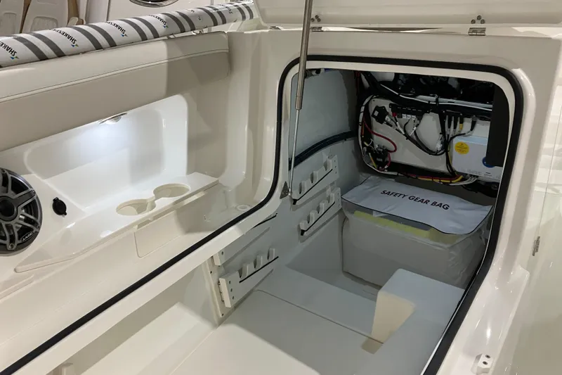 Slide: The Image of 2026 World Cat 265 DC-X boat interior with storage and safety gear bag. - 34