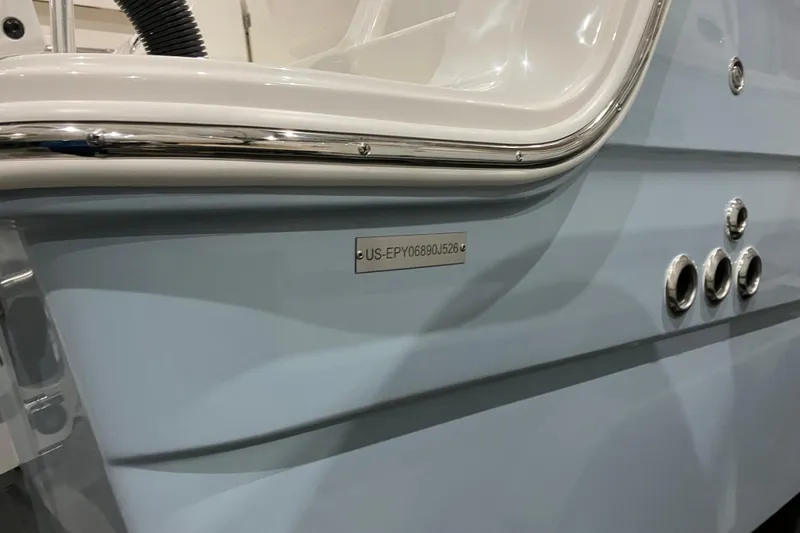 Slide: The Image of 2026 World Cat 265 DC-X boat detail with identification plate and chrome accents. - 38