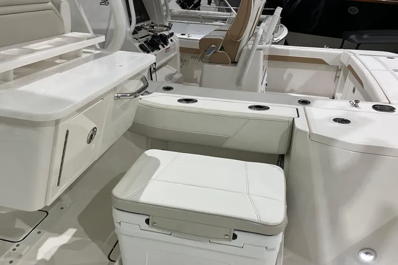 Slide: The Image of 2026 World Cat 265 DC-X boat interior with white seating and modern design. - 18
