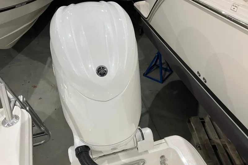 Slide: The Image of 2026 World Cat 265 DC-X boat engine in showroom display. - 14