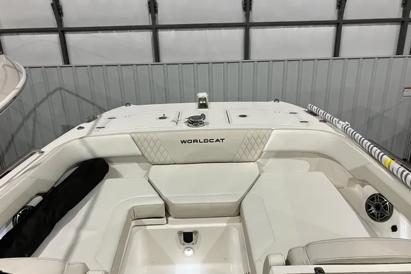 Slide: The Image of 2026 World Cat 265 DC-X boat interior with white seating and diamond stitching. - 28