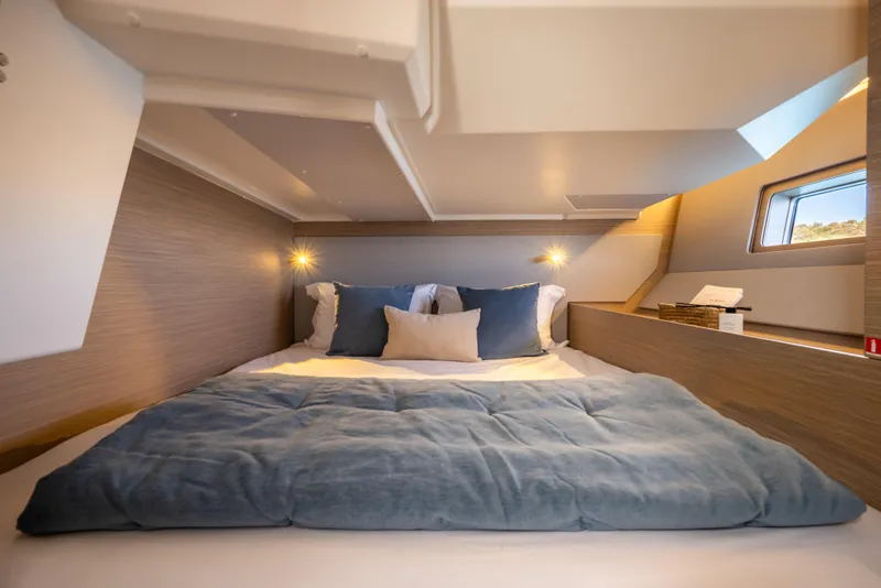 Slide: The Image of Luxurious cabin interior of 2026 Beneteau Oceanis 52 yacht with cozy bedding. - 10